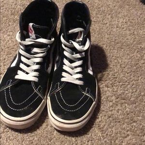 Black Vans with white accents